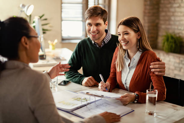 Couple signing mortgage documents